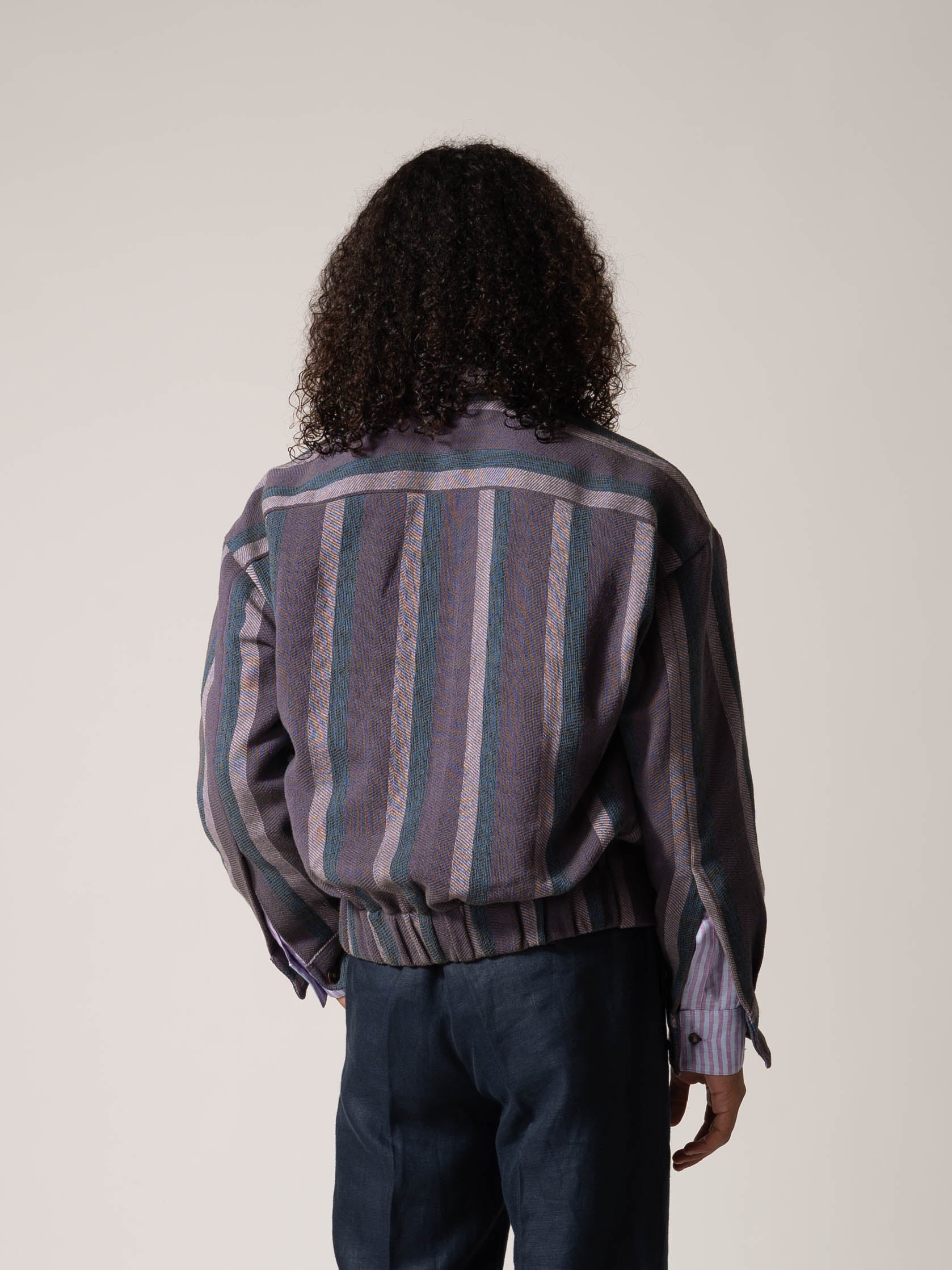 MODELWEARING-BOMBERJACKET-PURPLEANDBLUE-100_COTTON-HANDWOVEN-STRIPED-BACK