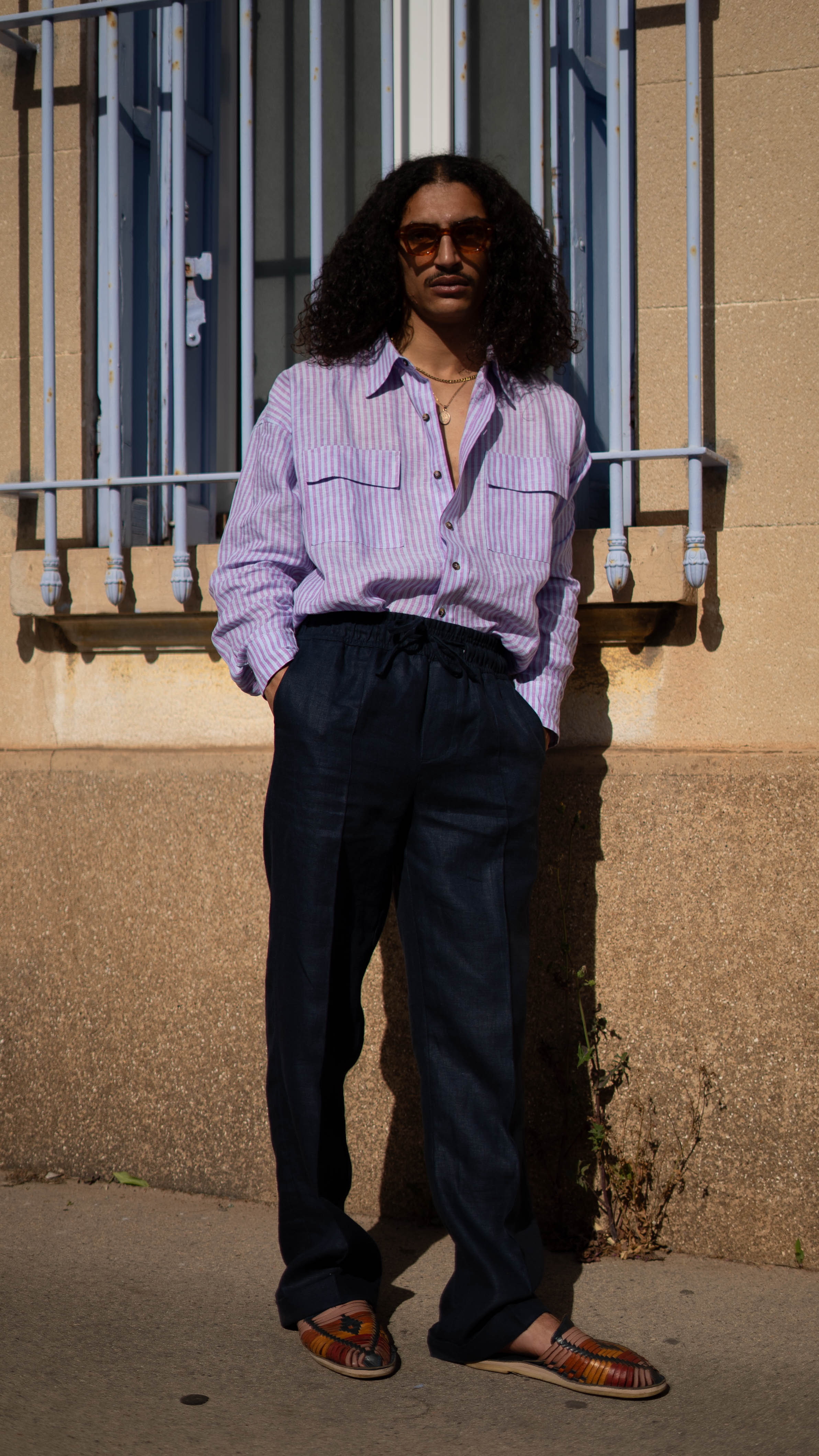 QUINTOPIANO STREET PHOTOGRAPHY Model wearing purple striped shirt with Yellow background