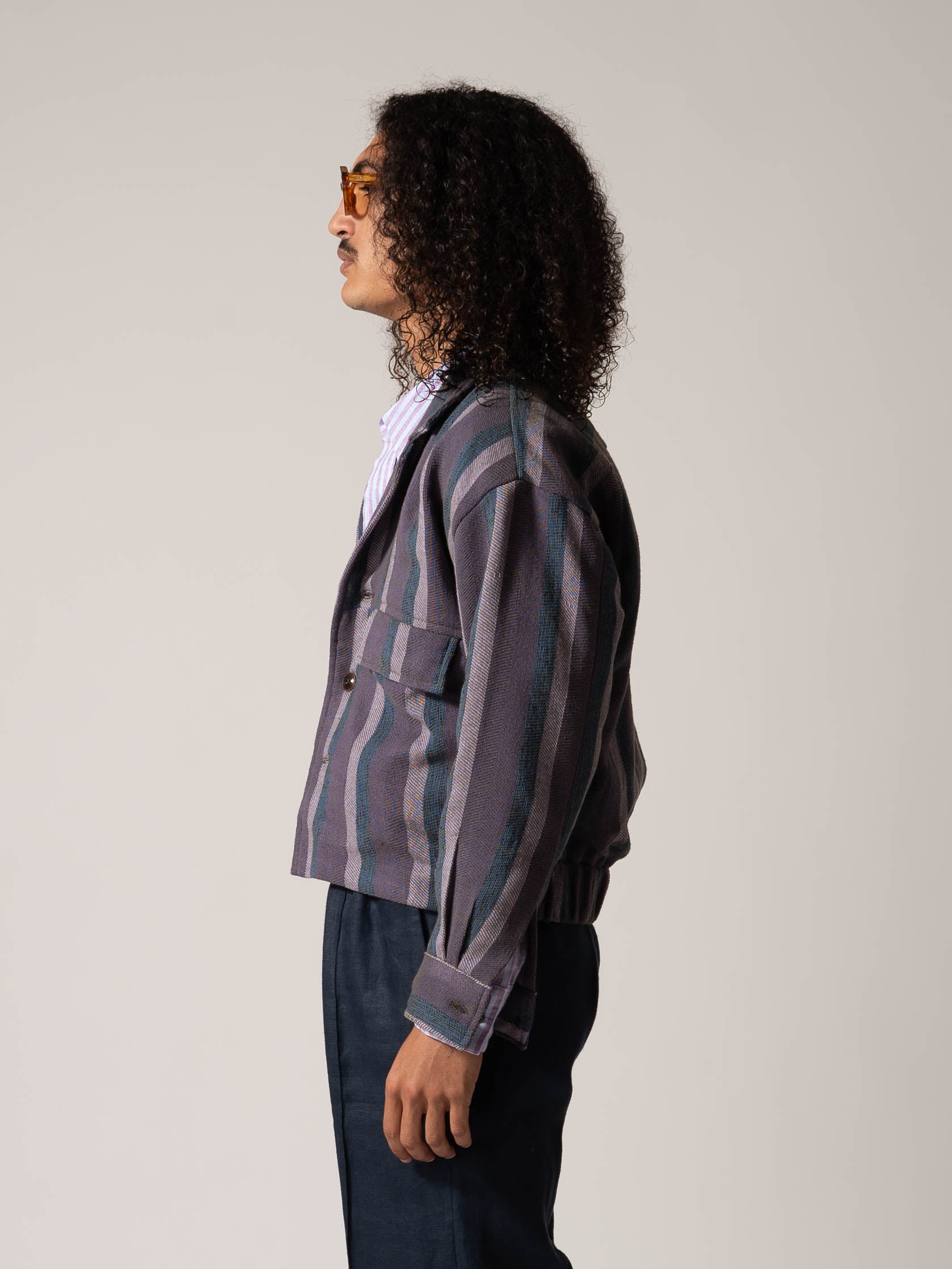 MODELWEARING-BOMBERJACKET-PURPLEANDBLUE-100_COTTON-HANDWOVEN-STRIPED-PROFILE