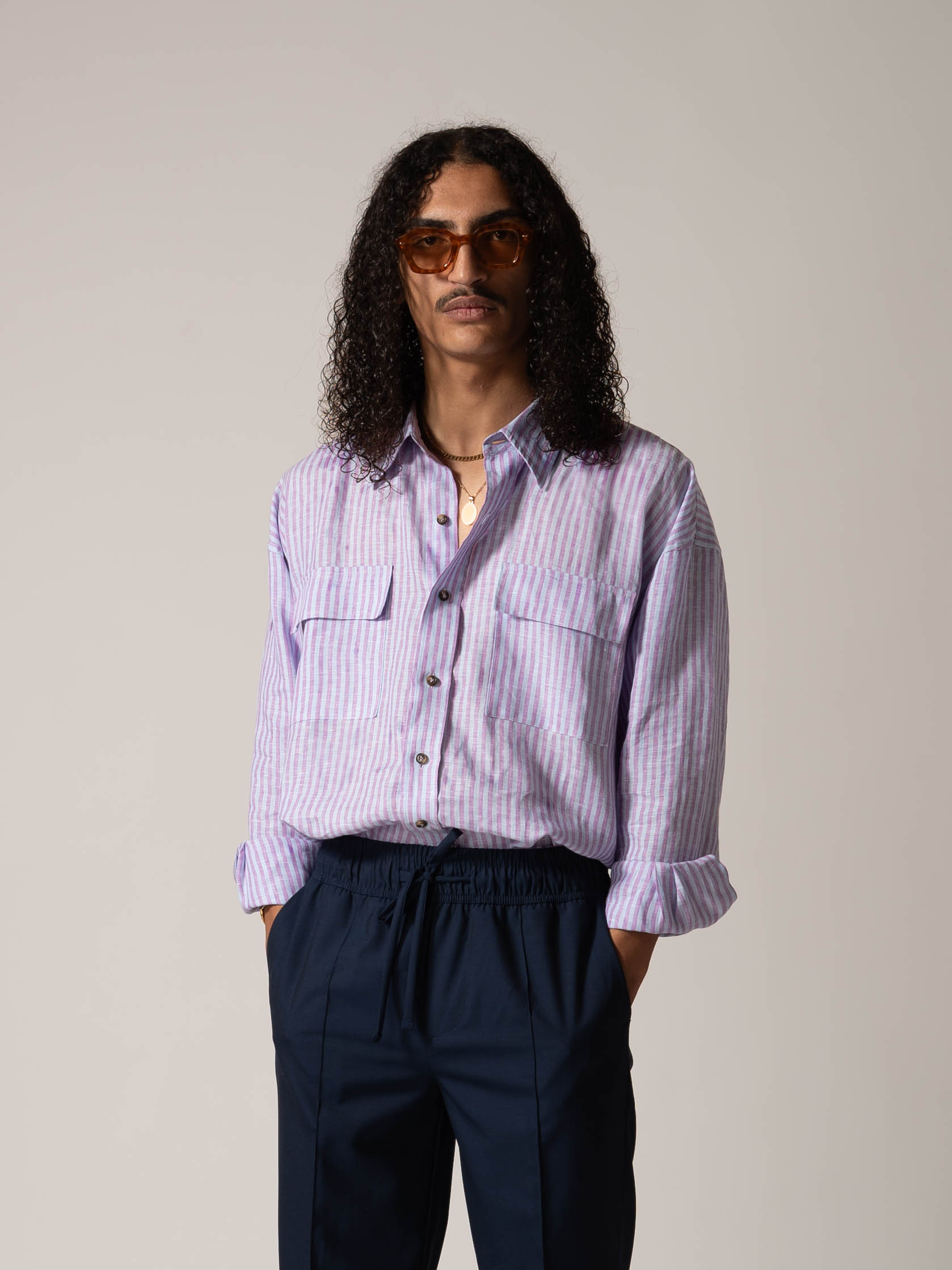 MODEL WEARING PURPLE STRIPED COTON AND LINEN