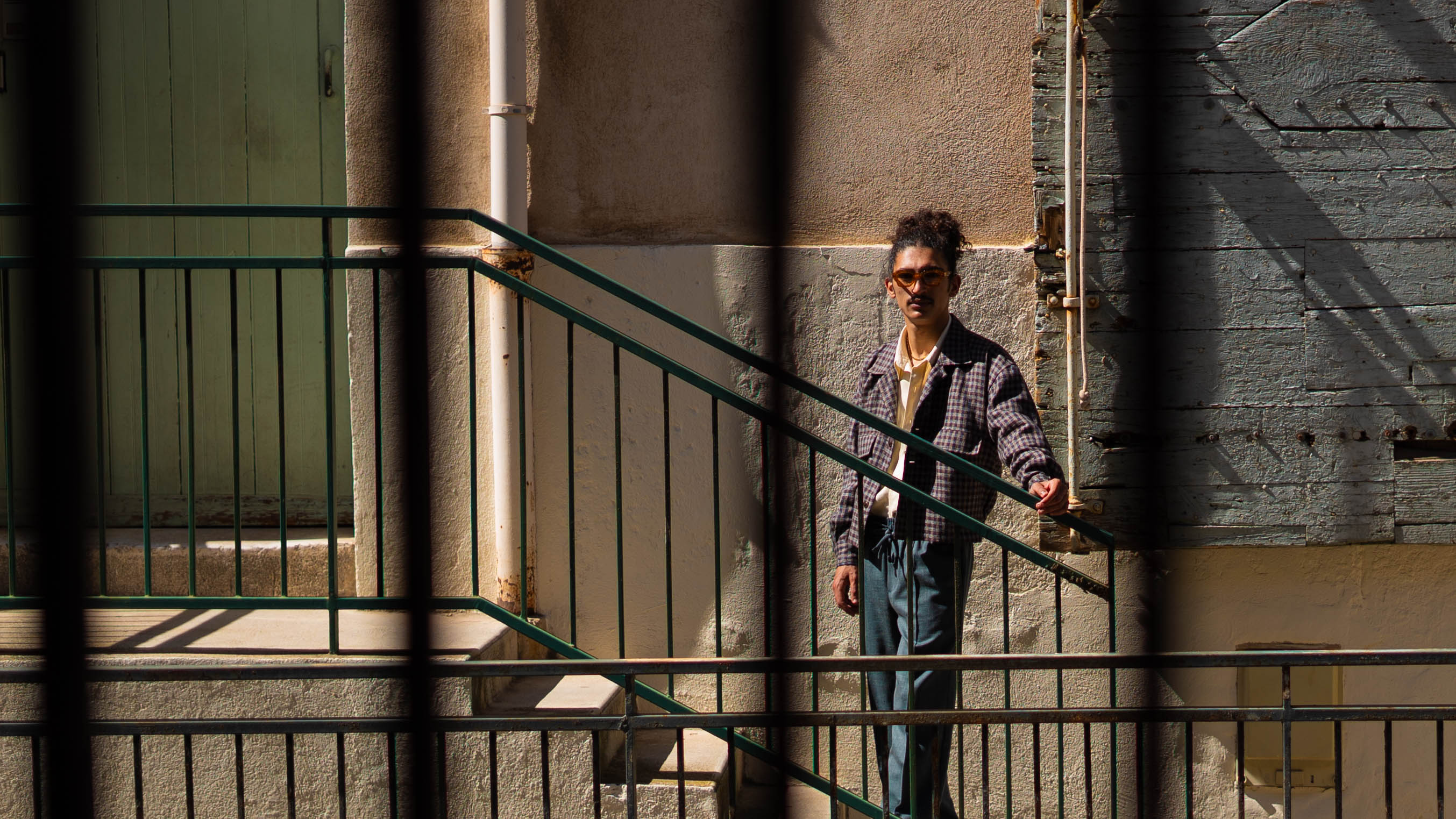 QUINTOPIANO STREET PHOTOGRAPHY Model wearing Checkered Overshirt with yellow background